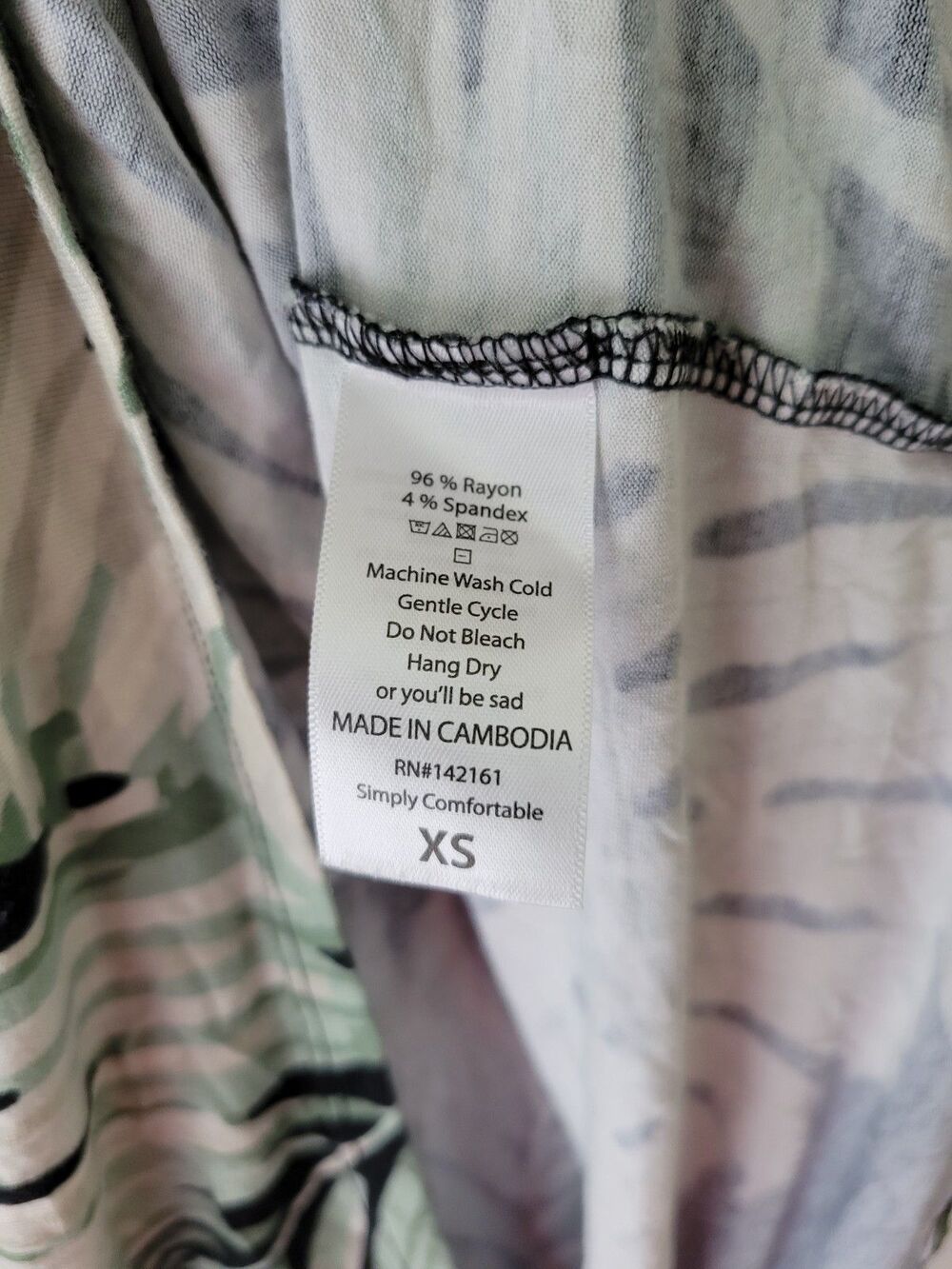 LuLaRoe Irma XS Tropical Palm Leaf Tunic Top Black Green High Low Stretch Knit - Picture 6 of 8